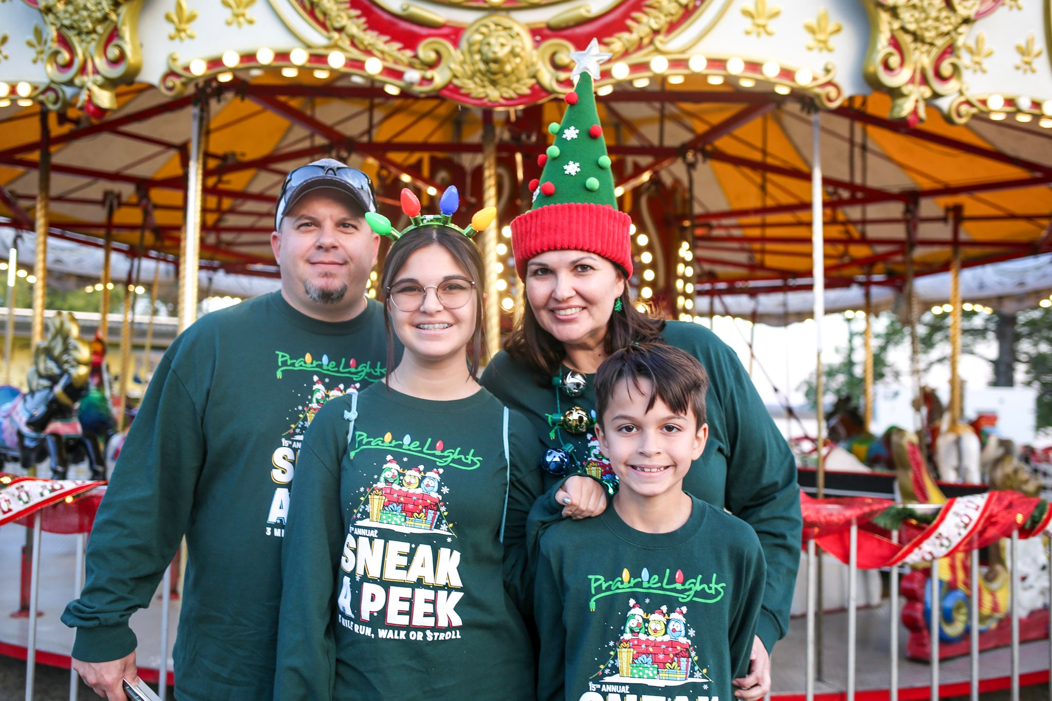 Family wearing matching Prairie Lights race shirts